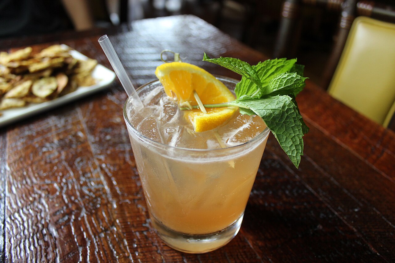 A tiki-style cocktail served in a decorative glass