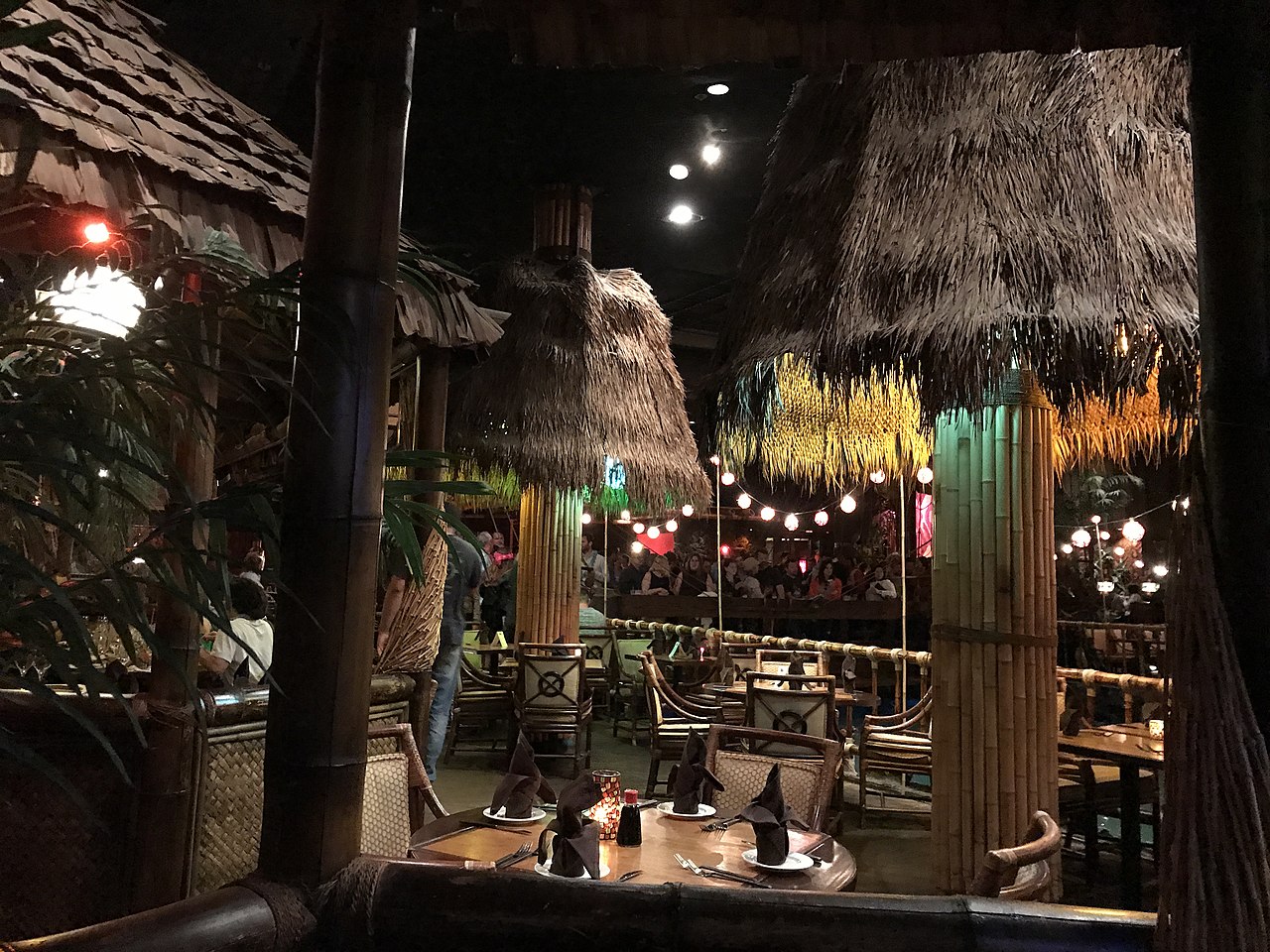 A tropical-themed restaurant interior with lush decor